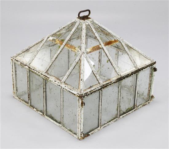 A late 19th century cast iron and glass cloche, 61cm.